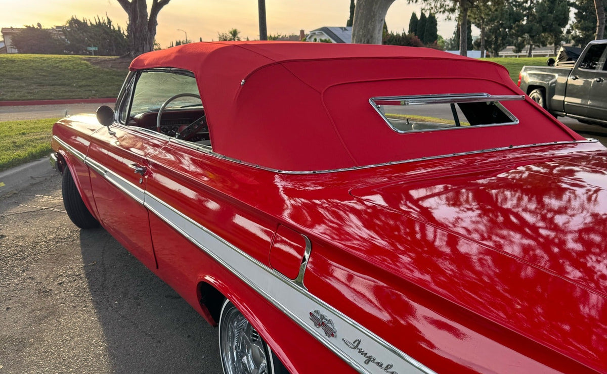 Red classic Chevrolet convertible with an installed chrome-framed Gangster Window